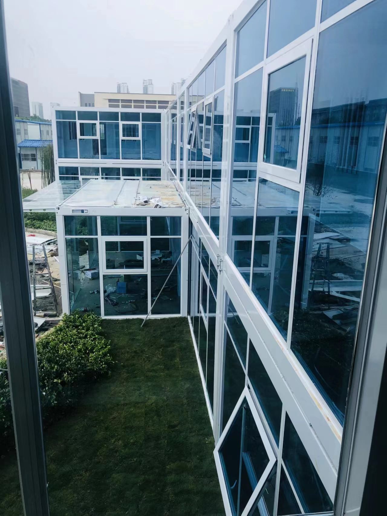 External first-floor walkway between connected modular rooms