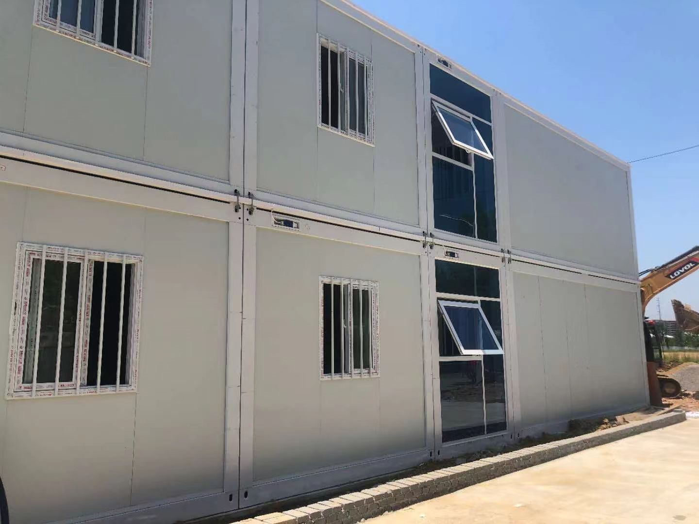 Two-storey modular project with stacked room units