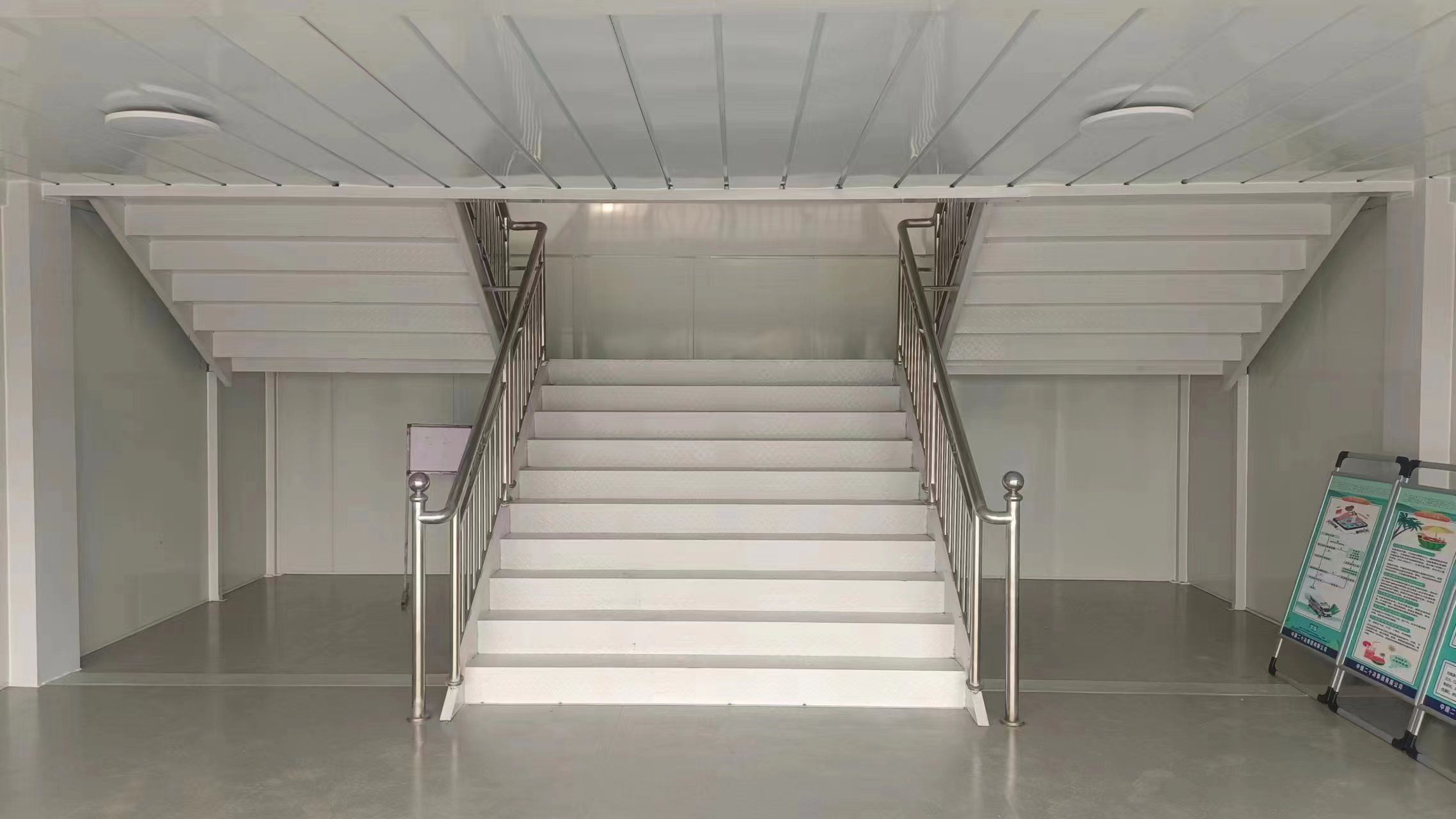 Wide central staircase installed between modular floors